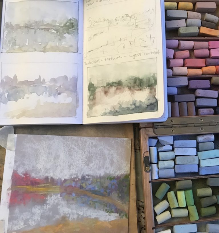Pastels in the studio, beside various art pads