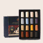 The Emme Colbert Animall 16 soft pastel set on display with an open box standing in front of a closed box.