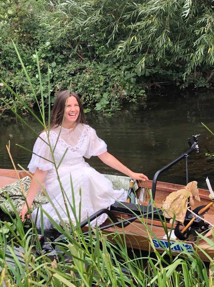 Women in a rowing boat, during the reenactment of the original painting 'Lady of Shalott'.