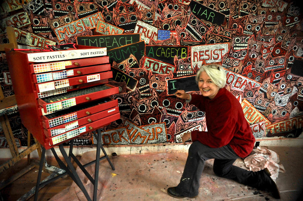 The Pastel is mightier than the Sword: Part 2 - Noise 1 Jane, with one of her paintings, in her studio, alongside a chest of drawers filled with Unison Colour Soft Pastels.