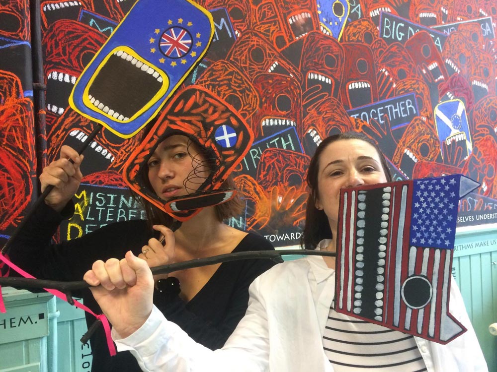 The Pastel is mightier than the Sword: Part 2 - Noise 6 People pose for selfies in front of the artwork.