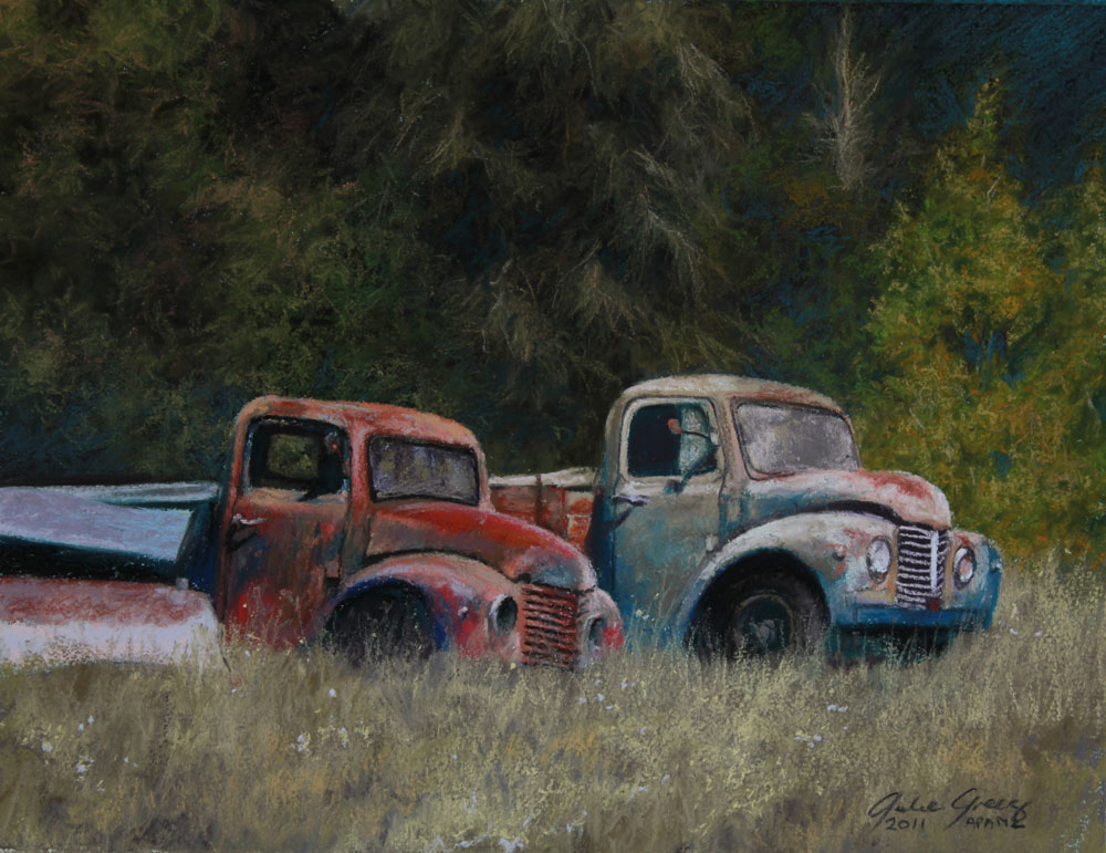 Sot pastel painting of old rusty pickups in a field.