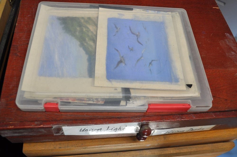 Susan's filing system using clear plastic folder boxes.