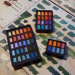 All 3 Centenary Sets laid out on some old colour swatches.