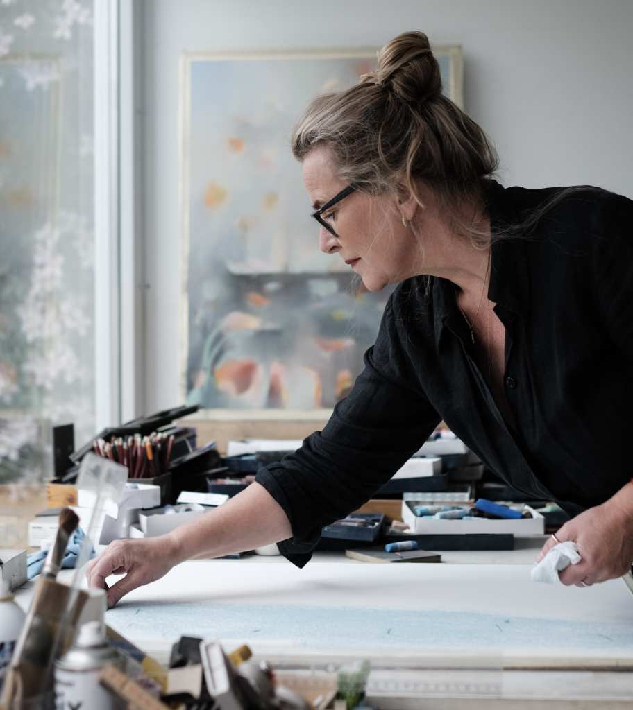Kristin, painting in her garden studio.