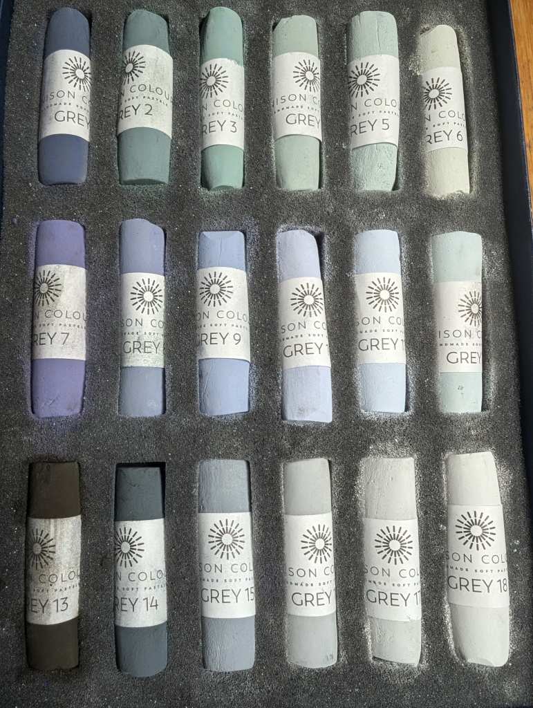 Rhonda's box of Grey 1-18 soft pastels.