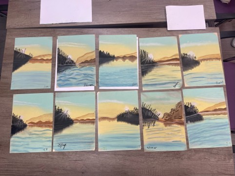 Everyone's paintings lined up.