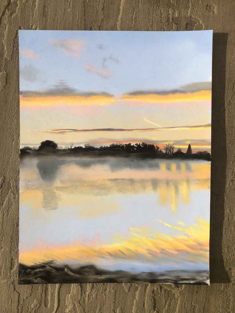 Sunrise over water by Angela Bell.